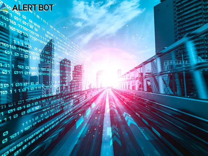 AlertBot Blog title "Unleashing the Web Guru: How Website Monitoring Boosts Traffic" with futuristic looking city with data ones and zeroes in the sky on the left and a road with a bright light in the center of the picture.